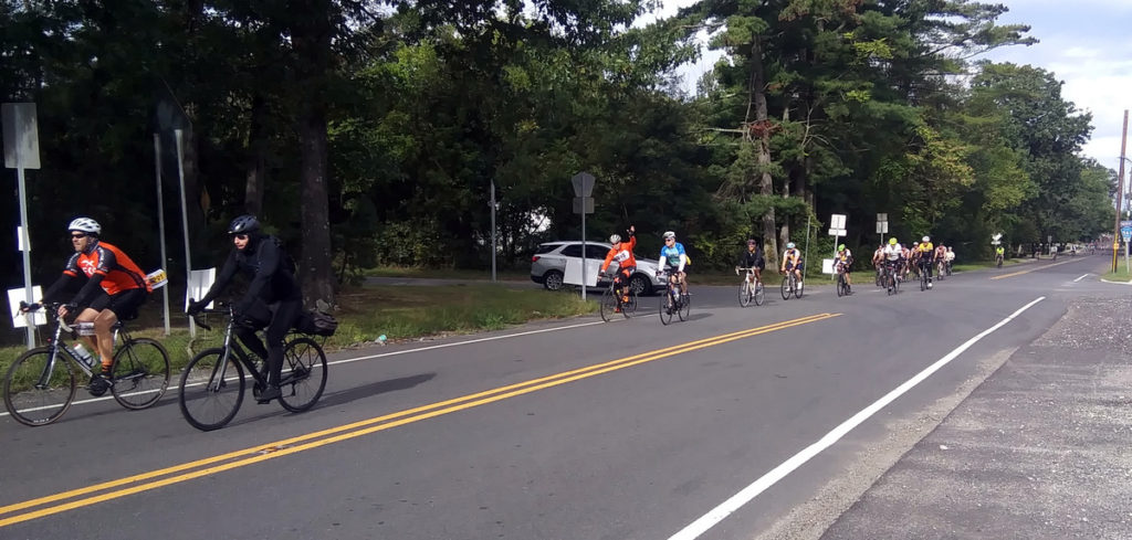 Bicyclists passing by approaching intersection.